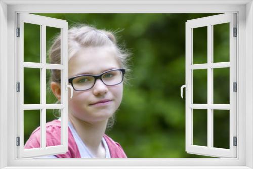 Young girl in park in spring day - portrait