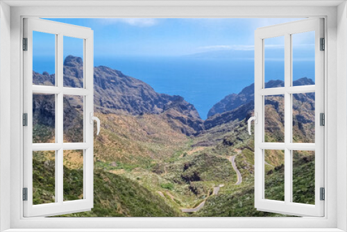 Fototapeta Naklejka Na Ścianę Okno 3D - Scenic view on the steep canyon of Teno mountain massif, Tenerife, Canary Islands, Spain, Europe. Hiking trail between village Masca and Santiago del Teide. Mountain road next to Roque de la Fortaleza