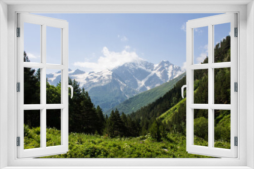 Fototapeta Naklejka Na Ścianę Okno 3D - Beautiful mountain landscape - snow-capped peaks with glaciers and green slopes with trees on a sunny summer day in the Elbrus region in the North Caucasus in Russia