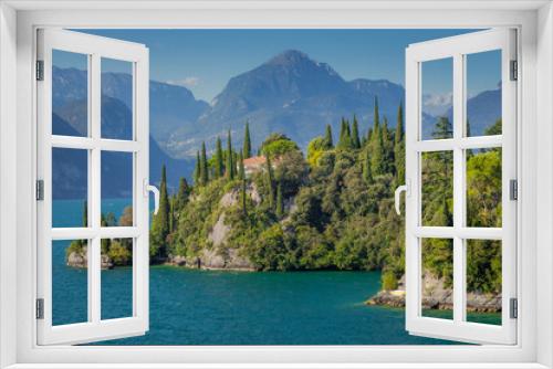 Fototapeta Naklejka Na Ścianę Okno 3D - Idyllic lake Garda coastline in Malcesine with cypress trees, Northern Italy