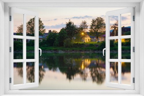 Fototapeta Naklejka Na Ścianę Okno 3D - View of Krpelany village reflecting in the canal of river Vah.