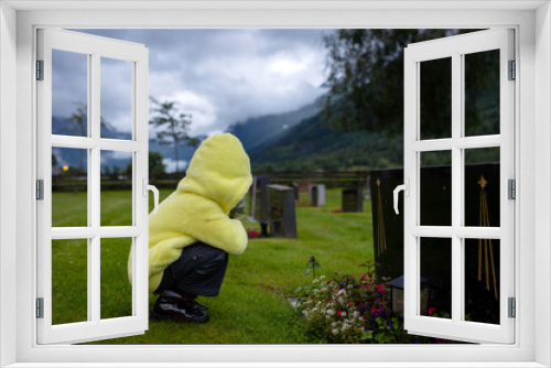Fototapeta Naklejka Na Ścianę Okno 3D - Sad little child, blond boy, standing in rain on cemetery, sad person, mourning