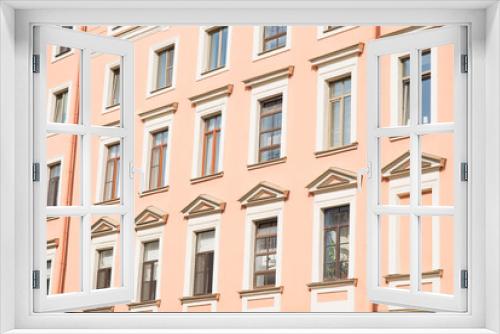 Fototapeta Naklejka Na Ścianę Okno 3D - View of the facade of the house with windows.