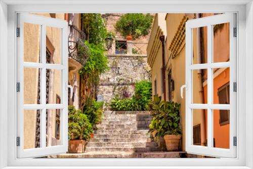 Fototapeta Naklejka Na Ścianę Okno 3D - Taormina, Italy - July 22, 2022: Scenic streets and sidewalks in Taormina, Sicily
