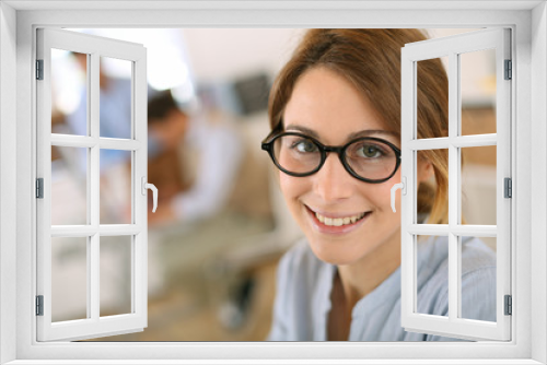 Cheerful student girl wearing eyeglasses