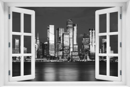 Fototapeta Naklejka Na Ścianę Okno 3D - Manhattan midtown skyline, seen from across the Hudson River at night. Beautiful reflections and light. High quality photo