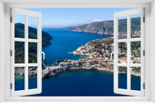 Fototapeta Naklejka Na Ścianę Okno 3D - Drone view to beautiful remote village in Greece, surrounded by crystal pacific blue and impressive cliffs on idyllic greek island in Ionian sea