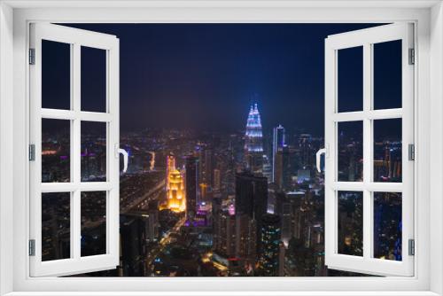 Fototapeta Naklejka Na Ścianę Okno 3D - Kuala Lumpur, Malaysia, 2019. Petronas twin towers at night with view on city lights