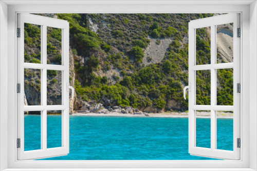 Fototapeta Naklejka Na Ścianę Okno 3D - Empty tropical beach in the Mediterranean, surrounded by turquoise water.  