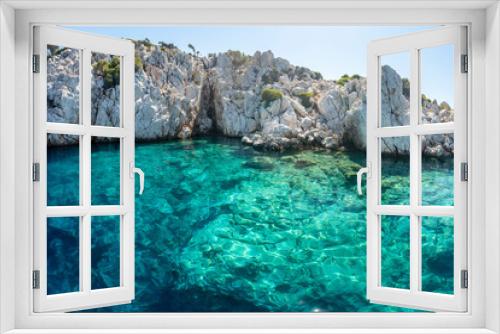 Fototapeta Naklejka Na Ścianę Okno 3D - Turquoise colored crystal clear water at a rocky island, Aegean Sea, Turkey