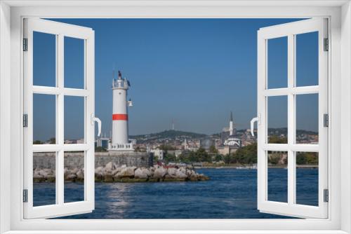Fototapeta Naklejka Na Ścianę Okno 3D - Lighthouse on the breakwater. Istanbul, Kadikoy, Haydarpasa