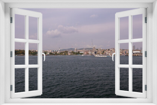 Fototapeta Naklejka Na Ścianę Okno 3D - silhouette Istanbul city buildings from water Bosphorus or Golden Horn, public places.