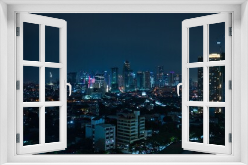 Fototapeta Naklejka Na Ścianę Okno 3D - Night city view of business district with skyscrapers in Manila, Philippines