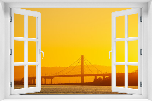 Fototapeta Naklejka Na Ścianę Okno 3D - San Francisco Oakland Bay Bridge landmark, beautiful sunrise with spectacular sky. Travel to California, United States.