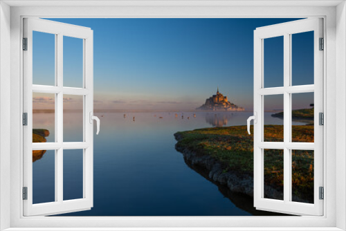 Fototapeta Naklejka Na Ścianę Okno 3D - Breathtaking sunrise at the famous Le Mont Saint-Michel tidal island , Normandy, France
