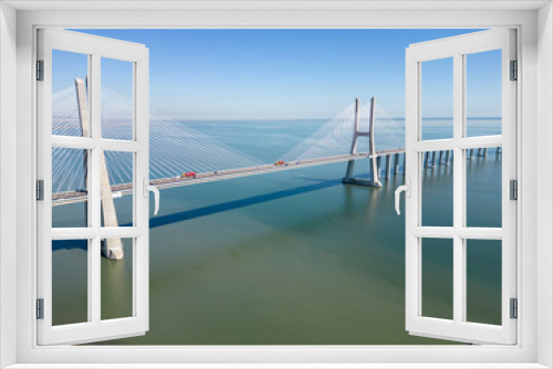 Fototapeta Naklejka Na Ścianę Okno 3D - Aerial footage Vasco da Gama bridge at Park of The Nations in Lisbon (Parque das Nações)