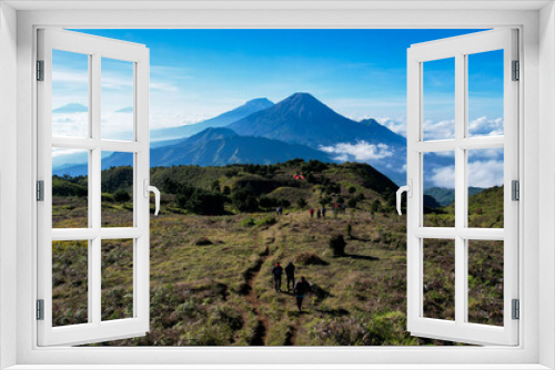 Fototapeta Naklejka Na Ścianę Okno 3D - Aerial view of beauty mountain peaks Prau Dieng, Central Java and the climbers and tent. 