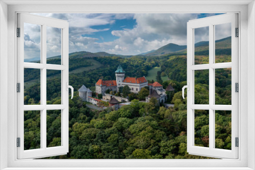 view of Smolenice Castle in the Little Carpathians in green late summer forest