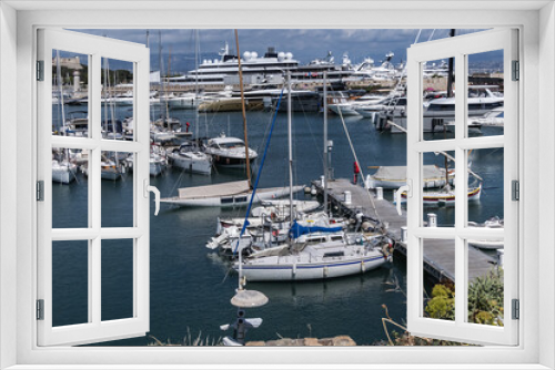 Fototapeta Naklejka Na Ścianę Okno 3D - View of the Port Vauban in Antibes with moored sailboats and luxury yachts on the French Riviera in sunny weather. Antibes, Alpes-Maritimes, France. 