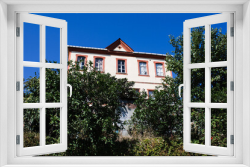 Fototapeta Naklejka Na Ścianę Okno 3D - house in the garden