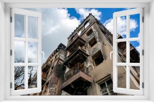 Fototapeta Naklejka Na Ścianę Okno 3D - destroyed and burned houses in the city during the war in Ukraine