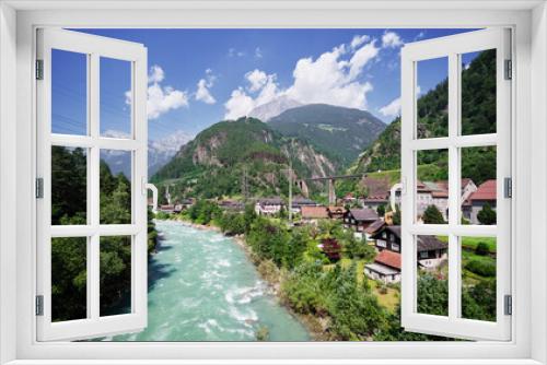 Fototapeta Naklejka Na Ścianę Okno 3D - Swiss landscape with river stream and houses.