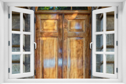 Fototapeta Naklejka Na Ścianę Okno 3D - French Style Hardwood Doors with a Arched Window on a Gray Building.