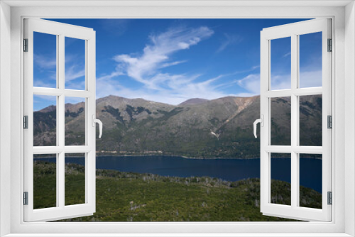 Fototapeta Naklejka Na Ścianę Okno 3D - Hiking in the mountains. View of the woods, hills and calm lake in a sunny day.