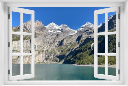 Fototapeta Naklejka Na Ścianę Okno 3D - Mountains landscape on the summer day with blue sky. Switzerland mountain with rocks, trees and forest. Nature landscape view with mountains and lake. Lake in the mountains. 