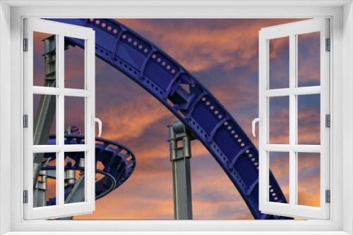 Fototapeta Naklejka Na Ścianę Okno 3D - Attraction roller-coaster (switchback) against the background of a romantic evening sky