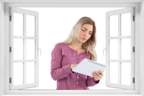 Young woman focused on her tablet pc