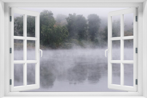 Fototapeta Naklejka Na Ścianę Okno 3D - Shawnee on Delaware, Pennsylvania: Early morning mist rising from waters of the Delaware River, in the Delaware Water Gap.