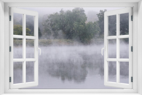 Fototapeta Naklejka Na Ścianę Okno 3D - Shawnee on Delaware, Pennsylvania, USA: Early morning mist rising from waters of the Delaware River, in the Delaware Water Gap.