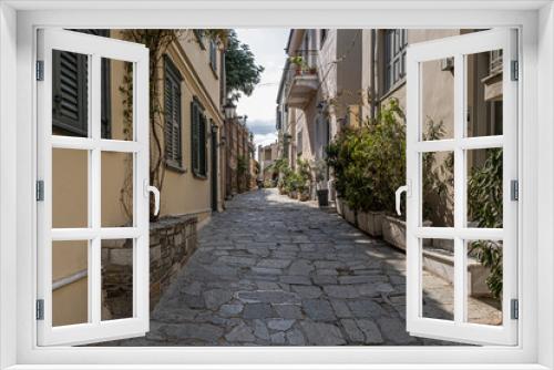 Fototapeta Naklejka Na Ścianę Okno 3D - Intimate, tranquil and sunlit street located at the foothill of Acropolis, Athens, Greece.