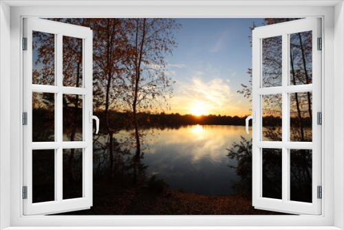 Fototapeta Naklejka Na Ścianę Okno 3D - Autumn landscape on the background of sunset on the lake shore. Beautiful view of nature in the evening. Hiking travel and recreation.