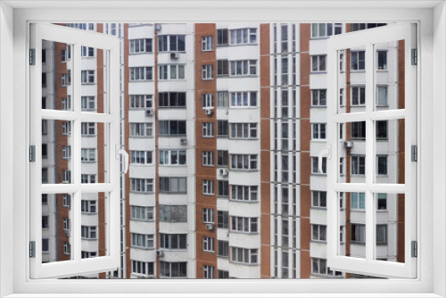 Fototapeta Naklejka Na Ścianę Okno 3D - Wall of apartment building with windows and balconies, horizontal photo. Exterior, image for background design, wallpaper. Facade of modern housing construction