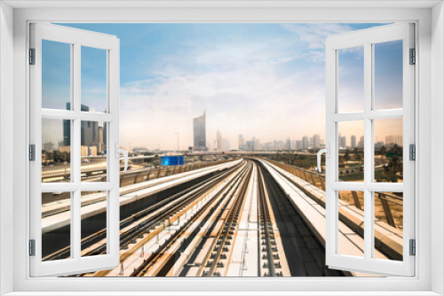 Fototapeta Naklejka Na Ścianę Okno 3D - Dubai, UAE. Train, tube track with City view at the distance