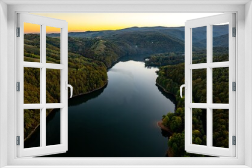 Fototapeta Naklejka Na Ścianę Okno 3D - Colorful aerial view of Secu Lake in Caras-Severin - Romania, in the autumn, at sunrise. Scene captured from above, with a drone.