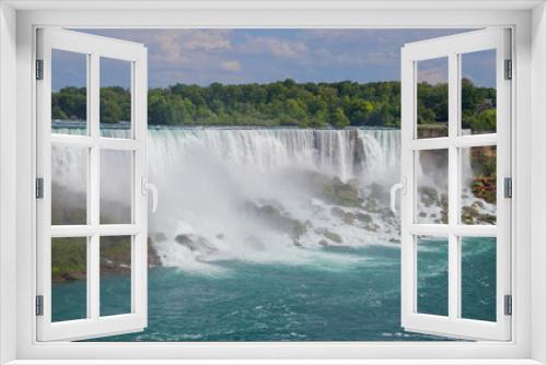 Fototapeta Naklejka Na Ścianę Okno 3D - American Falls view from Canada side on cloudy day. Waterfall with blue river and rocky shore. Summer. Cruise ship with tourists Niagara falls, Ontario, 
