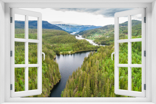 Fototapeta Naklejka Na Ścianę Okno 3D - Aerial view of a remote area in Norway with an idyllic river and a endless forest