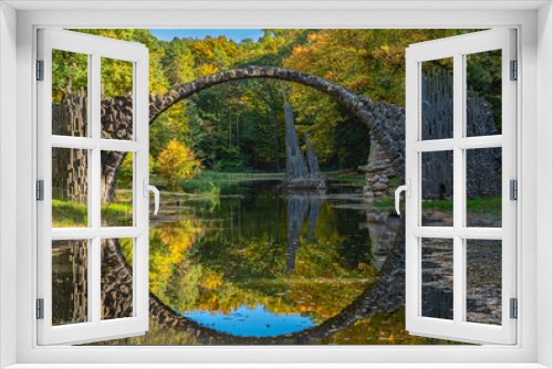 Fototapeta Naklejka Na Ścianę Okno 3D - Arch Bridge in Kromlau, Saxony, Germany. Colorful autumn in Germany. Rakotz bridge in Kromlau