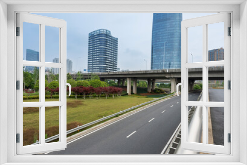 Fototapeta Naklejka Na Ścianę Okno 3D - Empty urban road and buildings in the city