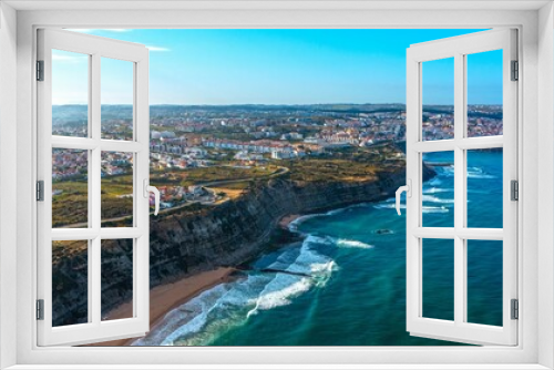 Fototapeta Naklejka Na Ścianę Okno 3D - Drone aerial view over beaches and  rocky coastline in  Portugal, during sunset. Aerial view to the Beautiful European touristic town. Beautiful cityscape with skyline, ocean rocky shore. Travel place