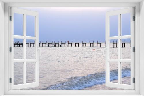 Fototapeta Naklejka Na Ścianę Okno 3D - long wooden pier on the beach
