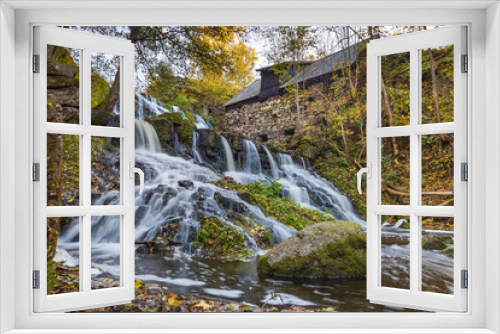 Fototapeta Naklejka Na Ścianę Okno 3D - Waterfall in the small town of Röttle in southern Sweden outside of Gränna, along the highway E4 during a sunny autumn day. 