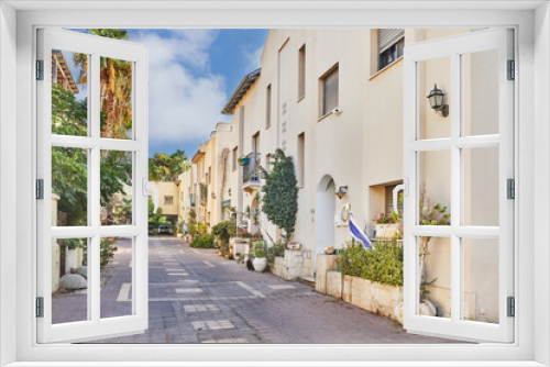 Fototapeta Naklejka Na Ścianę Okno 3D - Nice Israeli courtyard with Mediterranean-style residential buildings