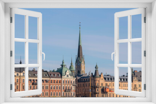 Fototapeta Naklejka Na Ścianę Okno 3D - Facades, roofs church tower in the district Östermalm a colorful autumn day in Stockholm