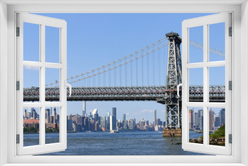 Fototapeta Naklejka Na Ścianę Okno 3D - Looking north at Brooklyn side of the Williamsburg bridge and the the skyline of Midtown Manhattan, NYC