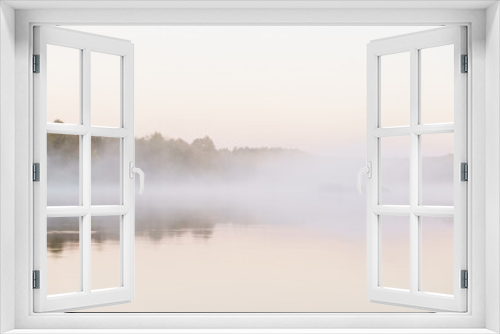 Fototapeta Naklejka Na Ścianę Okno 3D - Island in the morning fog on the lake, river.