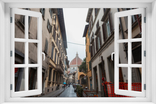 Fototapeta Naklejka Na Ścianę Okno 3D - Narrow European cozy street on a rainy day in Florence, Italy